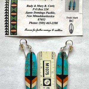 Feather earrings designed by artist from Santo Domingo Pueblo.